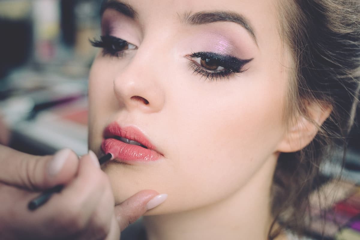 Beauty products and a model in soft daylight